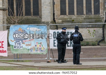 EXETER - FEBRUARY 11: Policemen standing by banner saying \