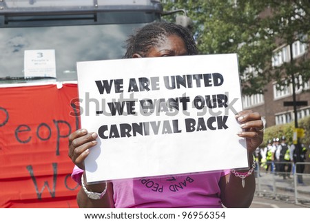 LONDON - AUGUST 30: Dancer holding a sign saying\