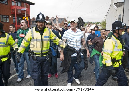 EXETER - MARCH 31: Devon and Cornwall Police escort football fans to prevent football violence at the League 1 match between Exeter City FC and Plymouth Argyle FC