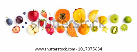 Creative layout made of fruits. Flat lay. Plum, apple, strawberry, blueberry, papaya, pineapple, lemon, orange, lime, kiwi, melon, apricot, pitaya, mango and carambola on the white background. 商業照片 © 