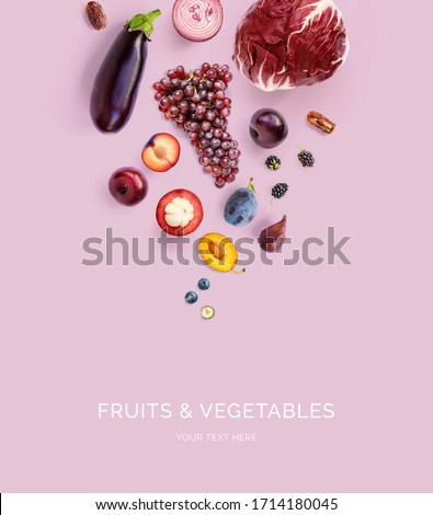 Creative layout made of mangosteen, onion, grapes, plum, blueberry, blackberry, dates, eggplant  on the purple background. Flat lay. Food concept. Macro  concept.