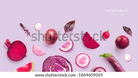 Creative layout made of different radish, beetroot, onion, eggplant, basil, cabbage on a purple background. Top view.  