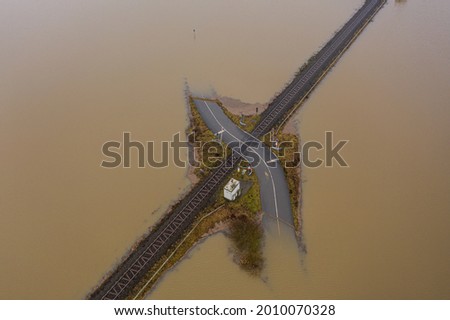 Flooding Germany .Flooded road passing through the railway. A road under water. 