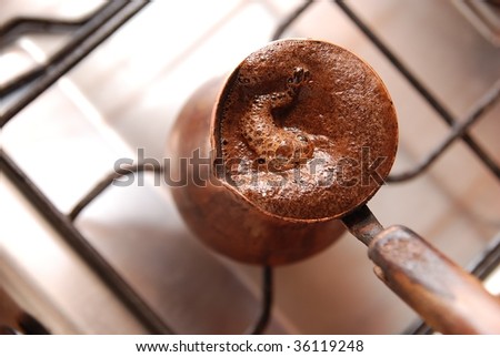 Delicious hot coffee made in turkish coffee-pot
