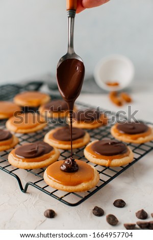 Similar – Image, Stock Photo Salted caramel chocolate cookies on ceramic plate