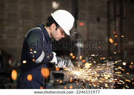 Similar – Image, Stock Photo Industrial worker using angle grinder grinding metal on welding seams. Worker working with angle grinder and has sparks. Tool for cut steel. Safety in industrial workplace. Metal factory industry.