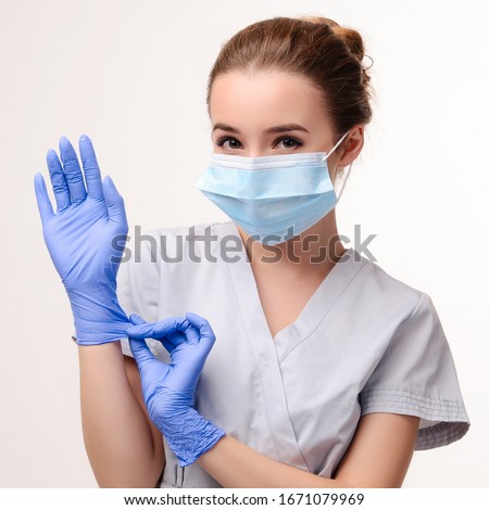 Similar – Image, Stock Photo Worker putting white face mask