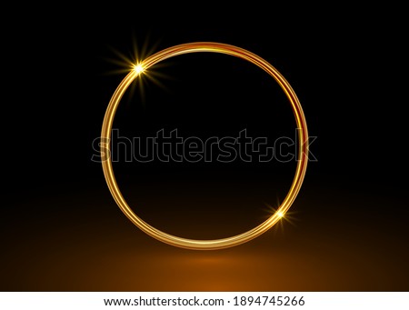 Vector magic gold circle frame. Glowing fire ring trace. Golden swirl trail effect isolated on black background. Bright luxury round ellipse line with flying flash lights and central copy space