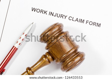 Directly above photograph of a work injury claim form.