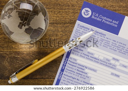 Filling customs declaration form before passing visa control.