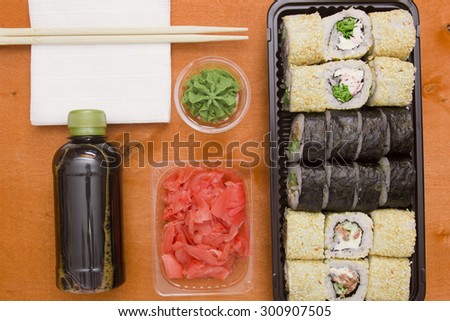 Set of sushi and rolls with wasabi and sauces, Asian traditional food.