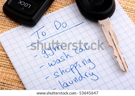 Key for the car on a piece of paper with the schedule of affairs.