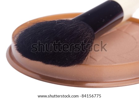Black powder brush and brown powder isolated on a white background.