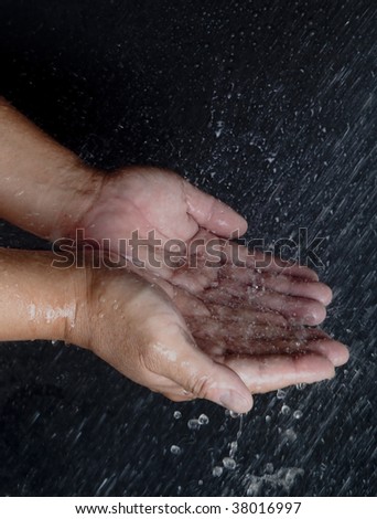Rain Water Falling on Hands