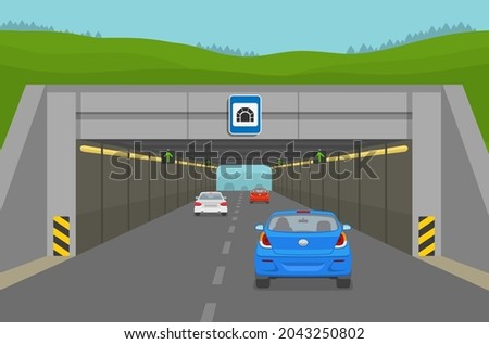 Driving a car. Blue sedan car driving into tunell. Steam of cars going through the city tunnel. Flat vector illustration template.