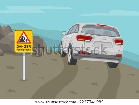 Driving on grades and hills. Off road vehicle roll angle. Back view of a suv car on a hill. Landslides and rockfalls on the road in the mountains. 