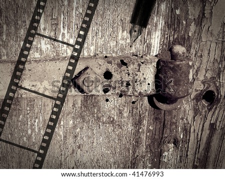 Rusty hinge on old door with vintage photo film and pen with grunge texture