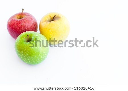 Three apples, red, green and yellow