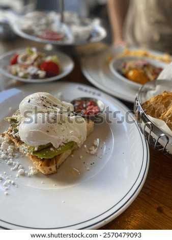 Similar – Image, Stock Photo There is nothing like fast Asian food. Like these noodles which a brunette model enjoys so much. Dressed in a shiny dress she is sitting in a restaurant under a red light. Feeling undeniably happy while she eats tasty food.