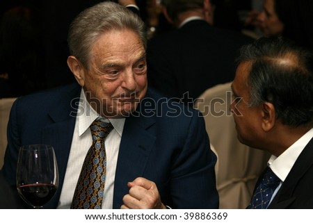 KUALA LUMPUR - DECEMBER 15: George Soros talking to former Malaysian Finance Minister Nor Mohamed Yakcop at the London School of Economics Alumni Dinner December 15, 2006 in Kuala Lumpur, Malaysia.