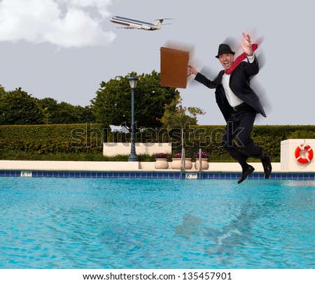 Businessman jumping into the water in a suit