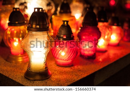 Candles Burning At a Cemetery During All Saints Day. Shallow depth of field.