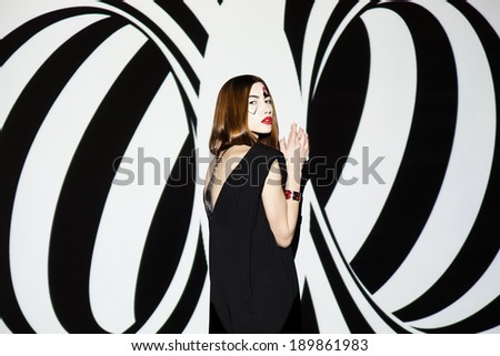 Fashion girl on black and white geometric background
