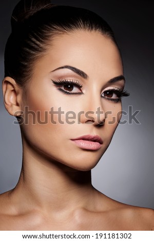 Closeup portrait of young beautiful  woman with long  eyelashes
