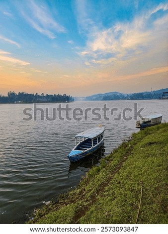 Image, Stock Photo small boats parked on the sand of a beach during sunset