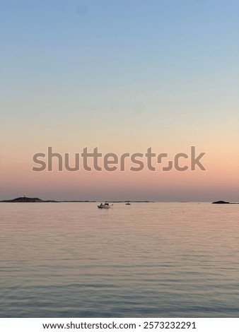 Similar – Foto Bild Felsenküste und friedliches Meer bei Sonnenuntergang