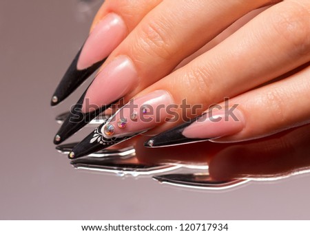 Manicure with reflection in the mirror. Woman fingers