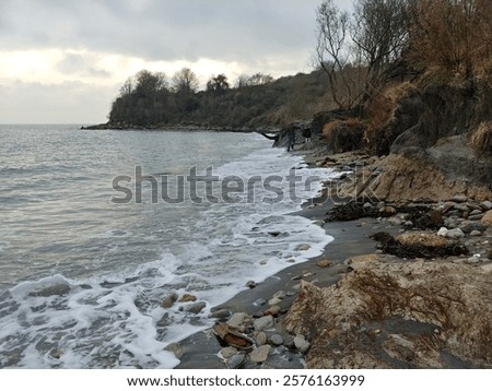 Similar – Foto Bild Größe Felsen im Wasser, Ostsee mit Wolken am Horizont