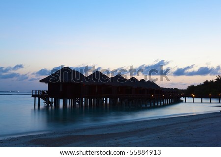 Water Villas in the sunrise. Welcome to the Paradise! Maldives. High Contrast.