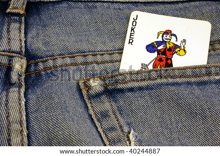 an old pair of jeans with a Joker card in the pocket