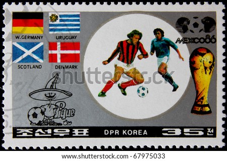 NORTH KOREA - CIRCA 1986:A post stamp printed in North Korea, shows football players, devoted Football World Cup Championship, Mexico City, series. circa 1986.