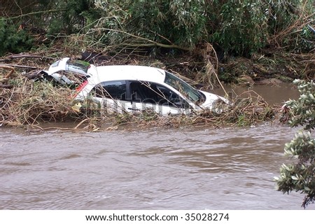 Car washed away by raging floodwaters
