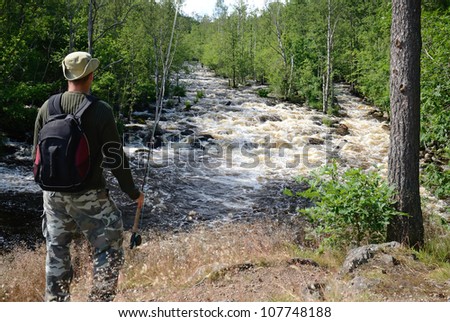 Angler and wild salmon river