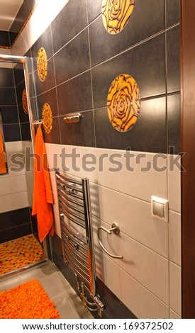 Wall with new toilet ceramics in orange & brown colors