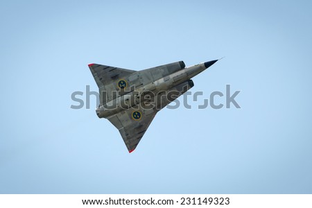 KALLINGE, SWEDEN - JUNE 01, 2014: Swedish Air Force air show 2014 at F 17 Wing. Saab 35 Draken with double delta wing in flight.