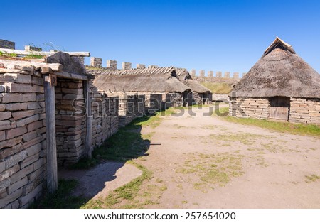 OLAND, SWEDEN - JUNE 21: Eketorp castle - inside village view, on Oland island on June 21,2014 in Sweden. Eketorp castle - built between 400-600AD and it\'s  tourist attraction on Oland island.