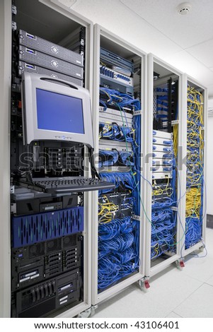 The mainframe and communication racks in data center for large organization