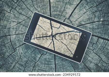 Cell phone on wooden table background