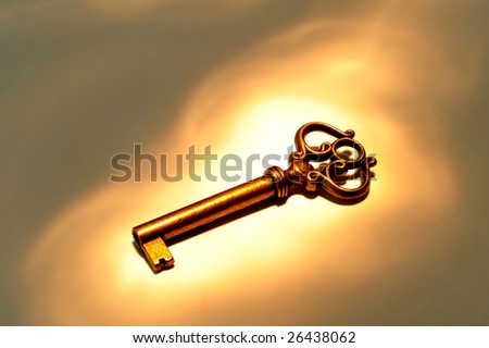 Simple old style key on dramatic spot light