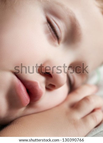 Funny sleeping little cute human child boy closed eyes face