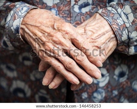 Aging process - very old senior woman hands wrinkled skin