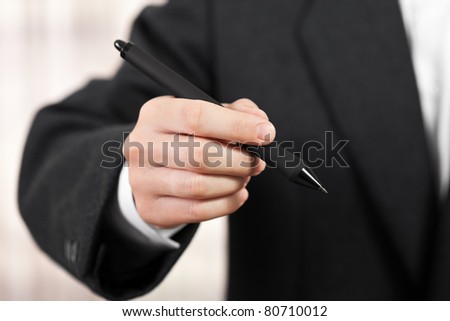 Business men hand hold paper writing ballpoint pen