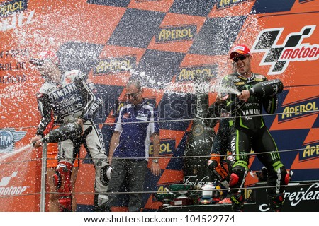 BARCELONA - SPAIN, JUNE 3: Champagne for the winners at 2012 Aperol MotoGP of Catalunya at Montmelo circuit on june 3, 2012 Barcelona