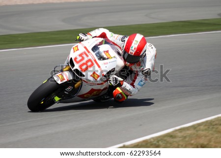 SACHSENRING, GERMANY - JULY 16: Italian rider Marco Simoncelli pushes hard during practice at Eni German Motorcycle Grand Prix 2010 on July 16, 2010 in Sachsenring, Germany