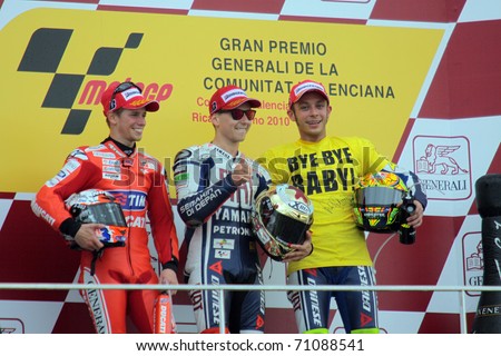 VALENCIA, SPAIN - NOVEMBER 7: Casey Stoner, Jorge Lorenzo and Valentino Rossi on the podium at Generali MotoGP of Valencia on November 7, 2010