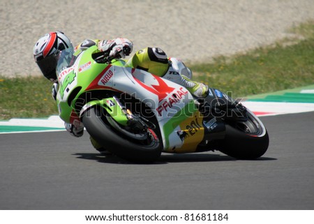 MUGELLO - ITALY, JULY 3: French Ducati rider Randy de Puniet pushes hard at 2011 TIM MotoGP of Italy on July 3, 2011